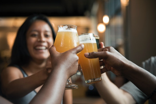 group of people drinking na beer having fun and not buying into myths of non alcoholic beer